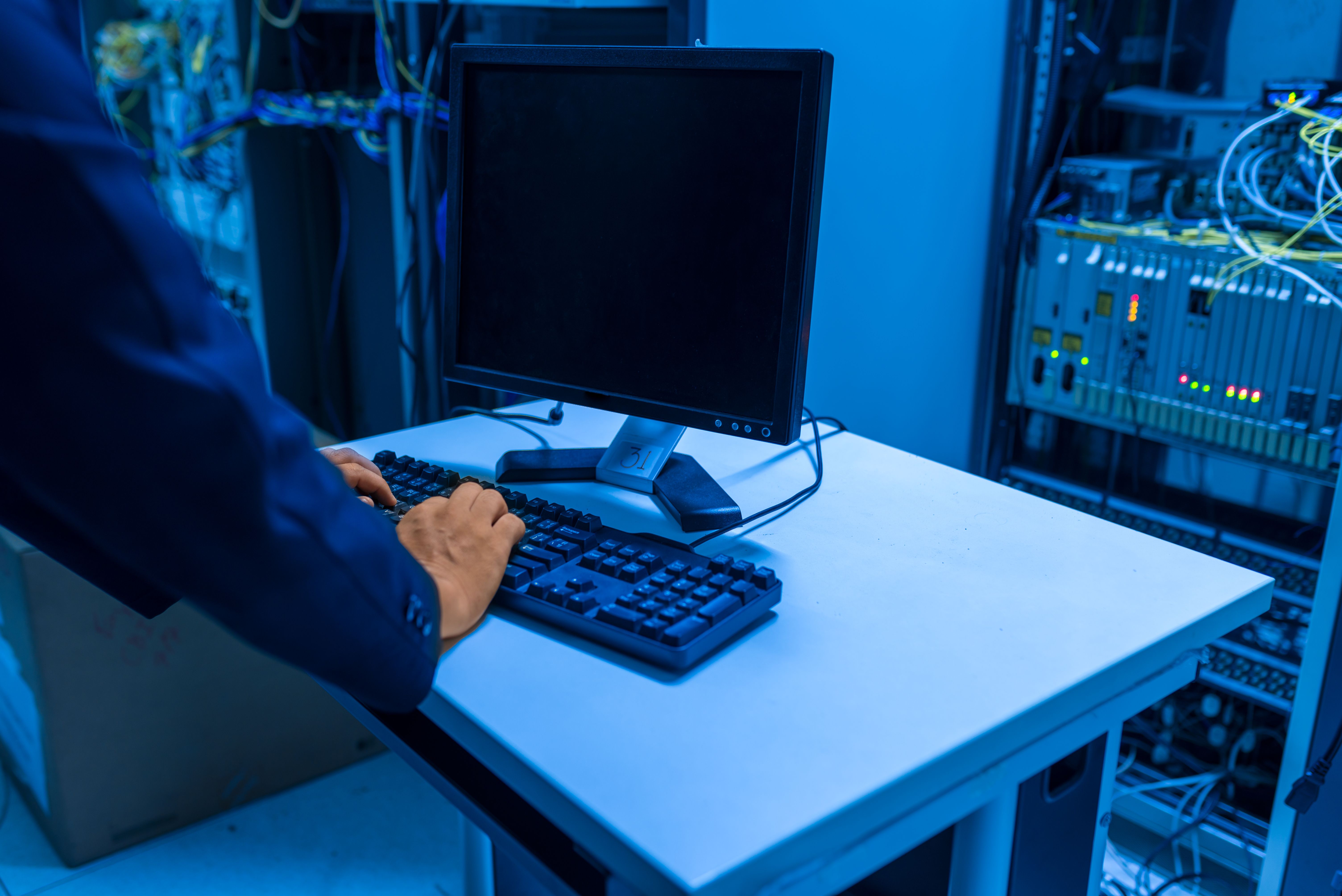 Technician monitoring network and security dashboards